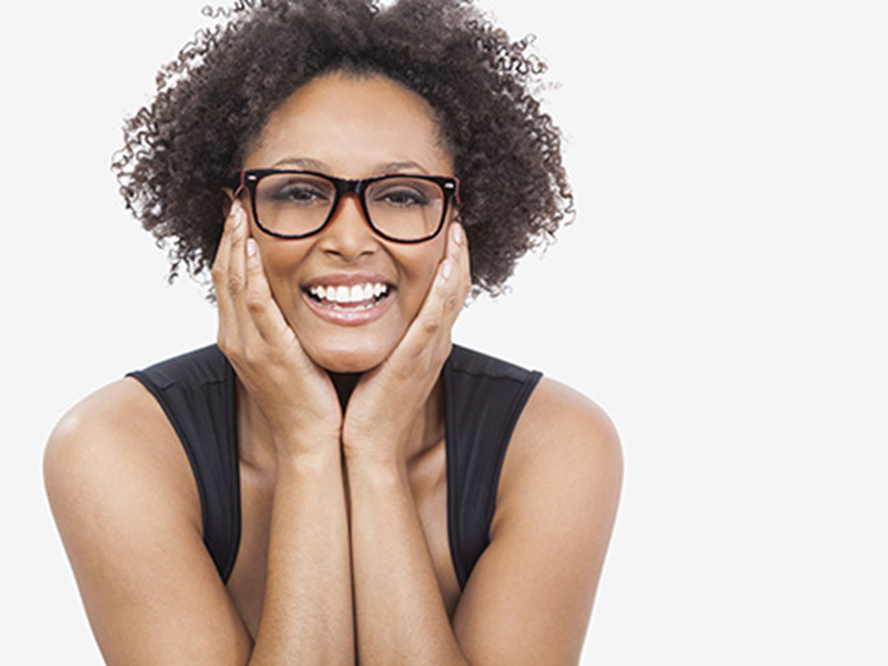 Woman smiling after treating inflamed gums in Florence, KY