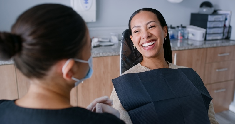 Young lady at the dentist cleaning for dental cleaning & examination in Florence & Tri-State area