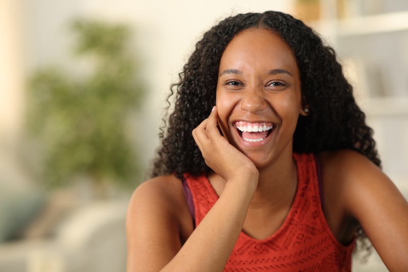 Woman radiating the after results of teeth whitening treatment in Florence, KY & Tri-State area